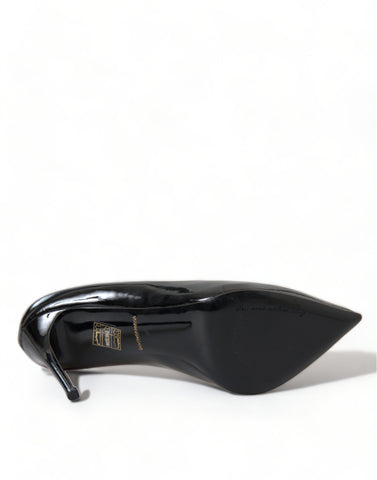 Black patent leather Dolce & Gabbana pumps with high heels and pointed toes, stylish and elegant footwear for women.