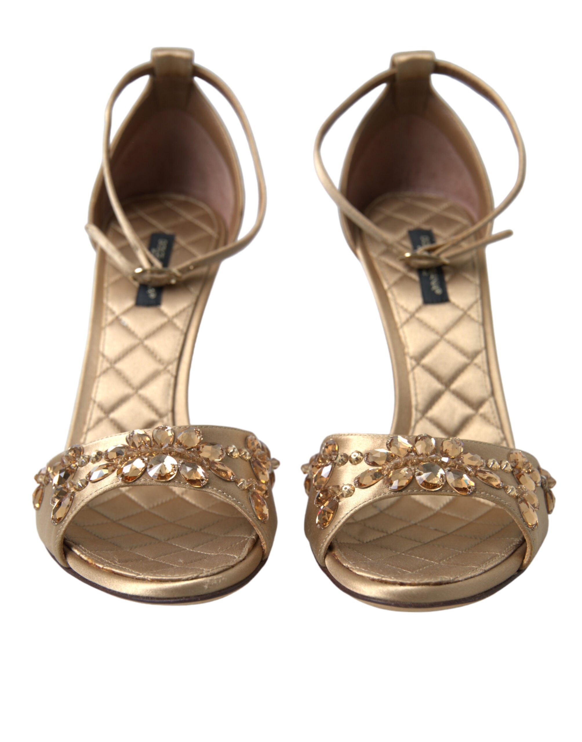 Gold satin ankle strap crystal sandals from Dolce & Gabbana with elegant heel and sparkling embellishments.