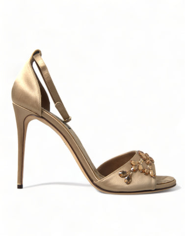 Gold satin ankle strap crystal sandals by Dolce & Gabbana with elegant crystal embellishments and a sleek design.