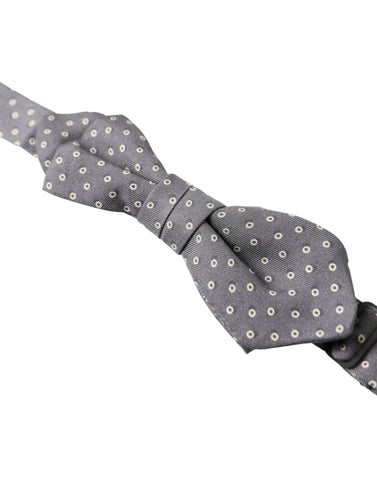 Gray polka dot silk adjustable bow tie with papillon style, by Dolce & Gabbana, featuring a classic elegant design.