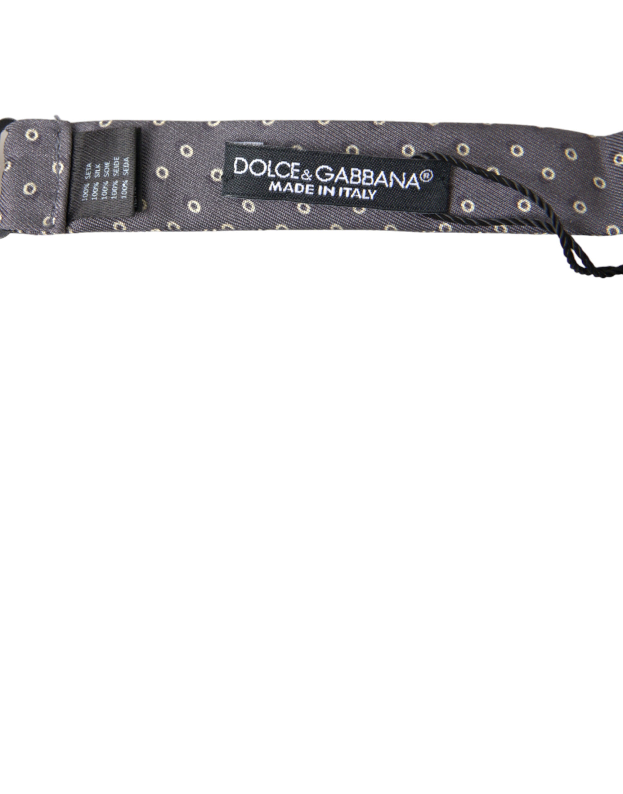 Gray silk polka dot bow tie with adjustable neck strap from Dolce & Gabbana, featuring a classic papillon style.
