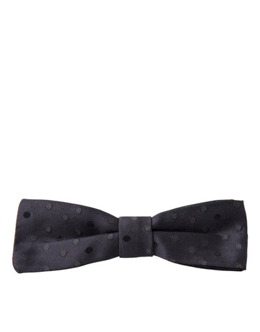 Blue polka dot silk adjustable men’s papillon bow tie by Dolce & Gabbana, featuring a classic polka dot pattern and elegant design.