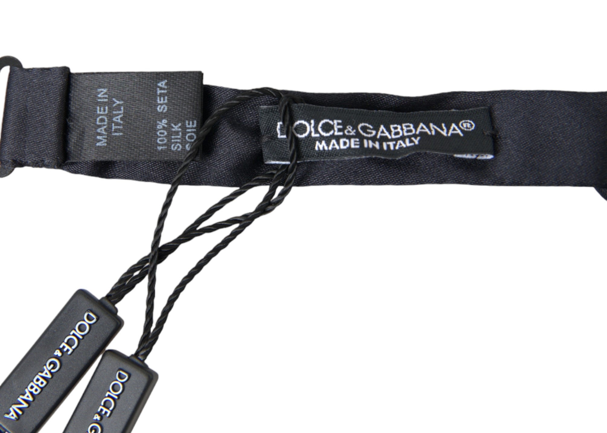 Dark blue silk satin adjustable neck bow tie for men, styled as a luxurious Dolce & Gabbana papillon bow tie.