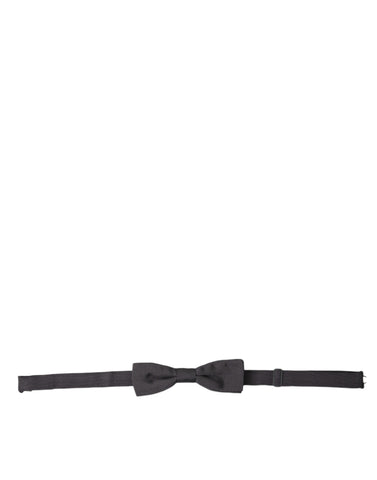 Dark gray silk adjustable men's bow tie with papillon style from Dolce & Gabbana, featuring a sleek, elegant design.