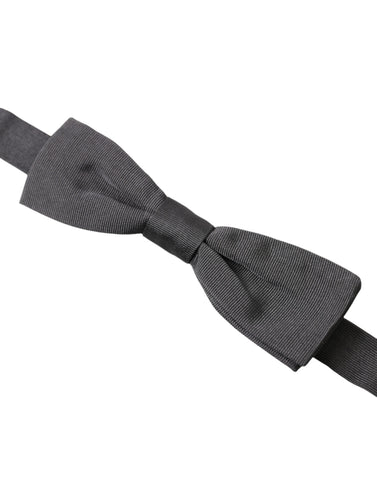 Dark gray silk adjustable neck bow tie for men by Dolce & Gabbana, featuring a classic papillon style.