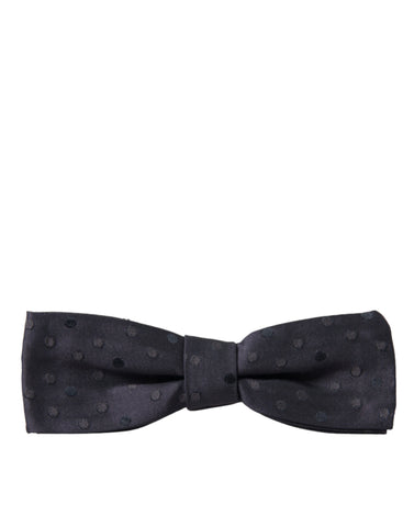 Blue polka dot silk adjustable bow tie for men, stylish Dolce & Gabbana papillon neck accessory with classic pattern.