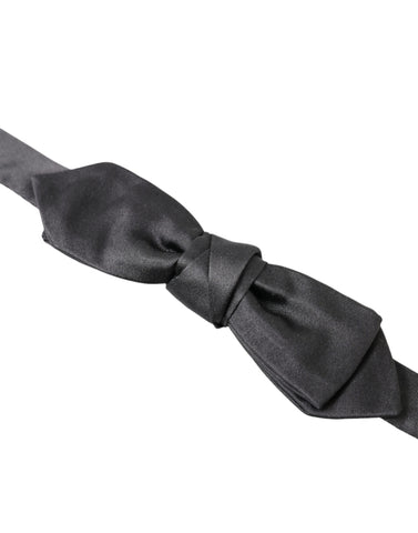 Dark gray silk adjustable men's bow tie featuring a papillon style from Dolce & Gabbana, shown in close-up image.