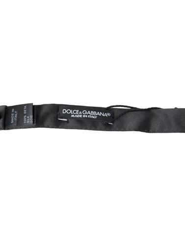 Dark gray silk adjustable men's bow tie featuring a papillon style, from Dolce & Gabbana, with a classic and elegant design.