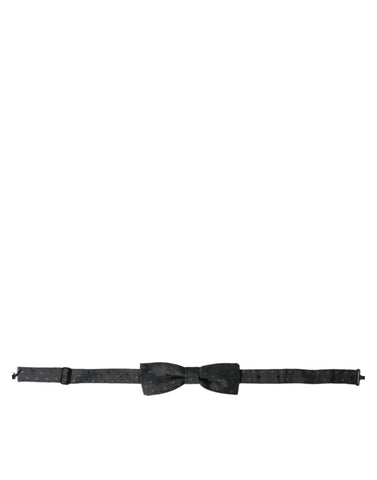 Gray silk polka dot adjustable neck bow tie for men by Dolce & Gabbana, featuring a classic papillon style and elegant design.