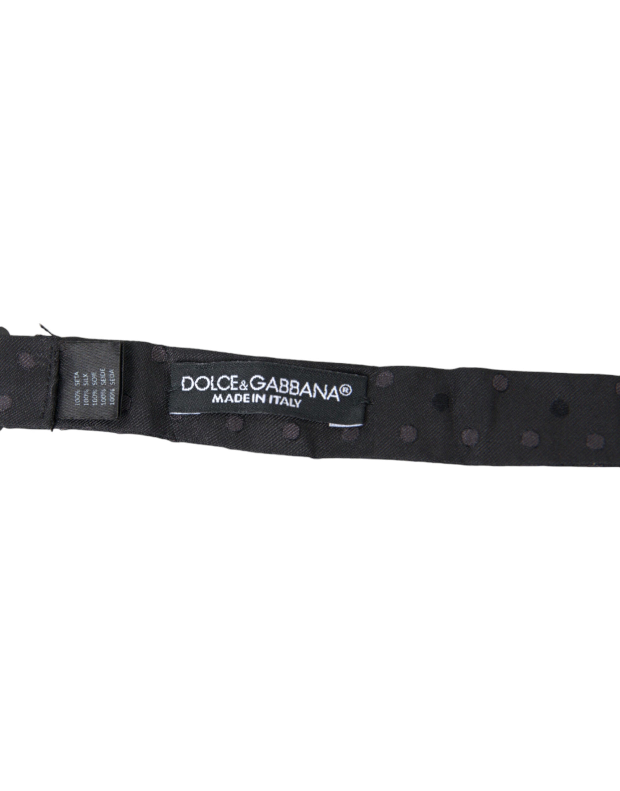 Gray polka dot silk adjustable neck bow tie for men by Dolce & Gabbana, featuring a classic papillon style.