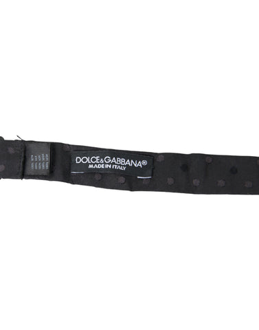 Gray polka dot silk adjustable neck bow tie for men by Dolce & Gabbana, featuring a classic papillon style.