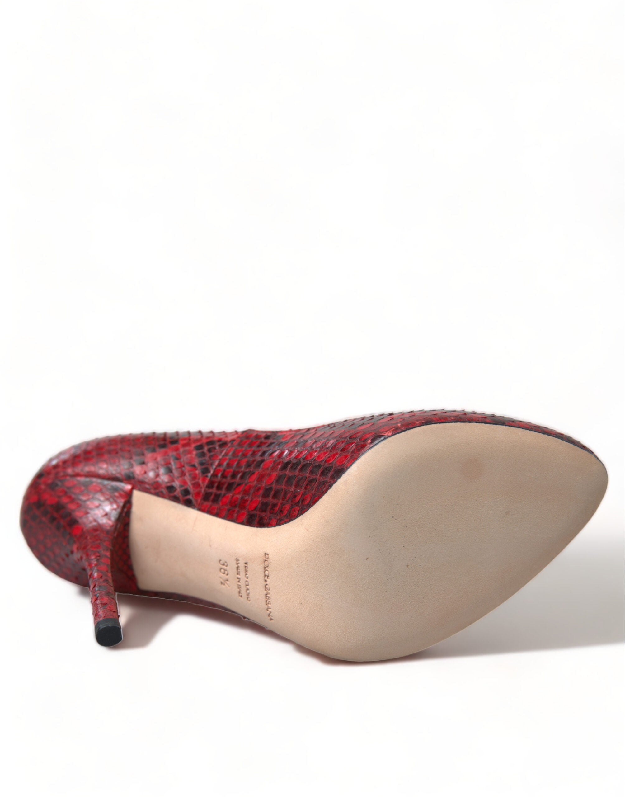 Red leather lace-up sock pumps by Dolce & Gabbana with a sleek, stylish design and pointed toe.