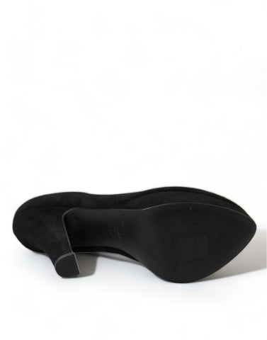Black suede leather platform heel pumps by Dolce & Gabbana, featuring a sleek design and high stiletto heel.
