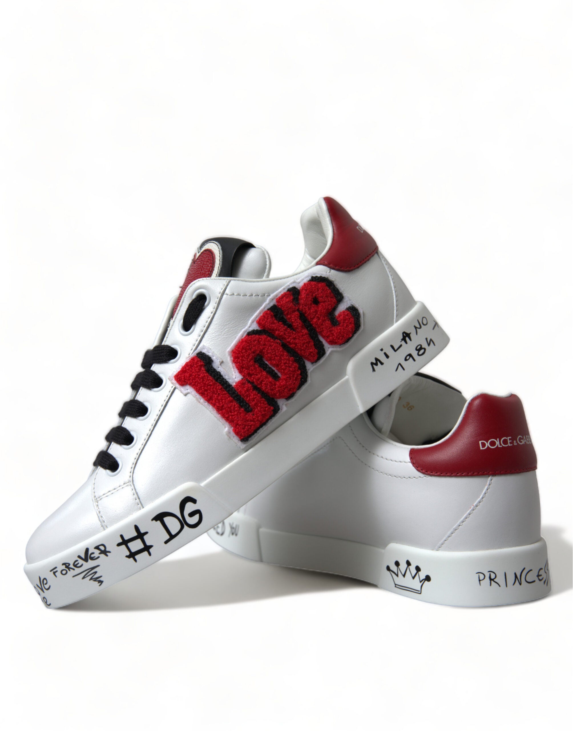 White Dolce & Gabbana Love Patch Portofino Classic Sneakers showing white canvas shoes with love patch detail and rubber sole.