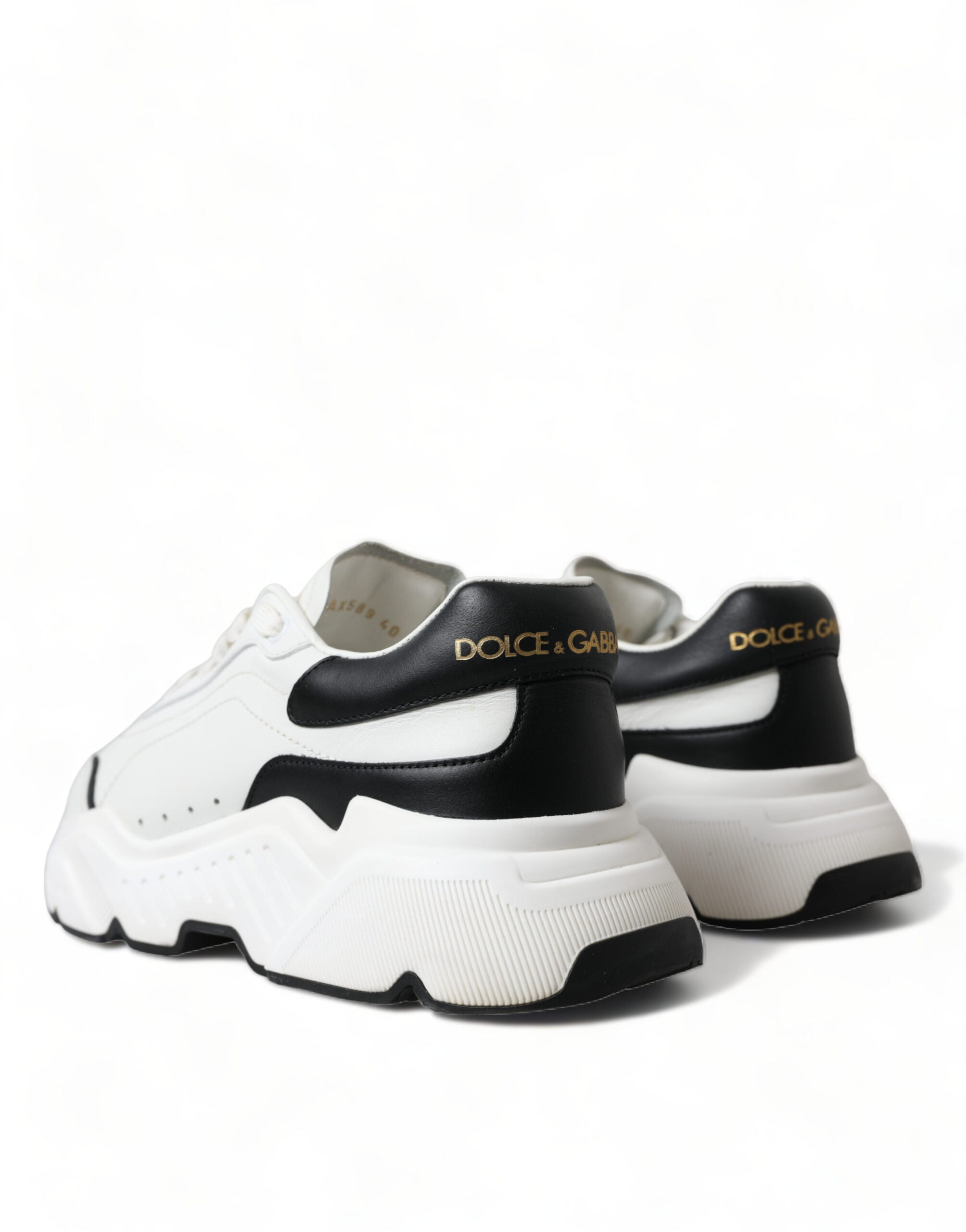 White and black Dolce & Gabbana low-top Daymaster sneakers with sleek design and comfortable fit.