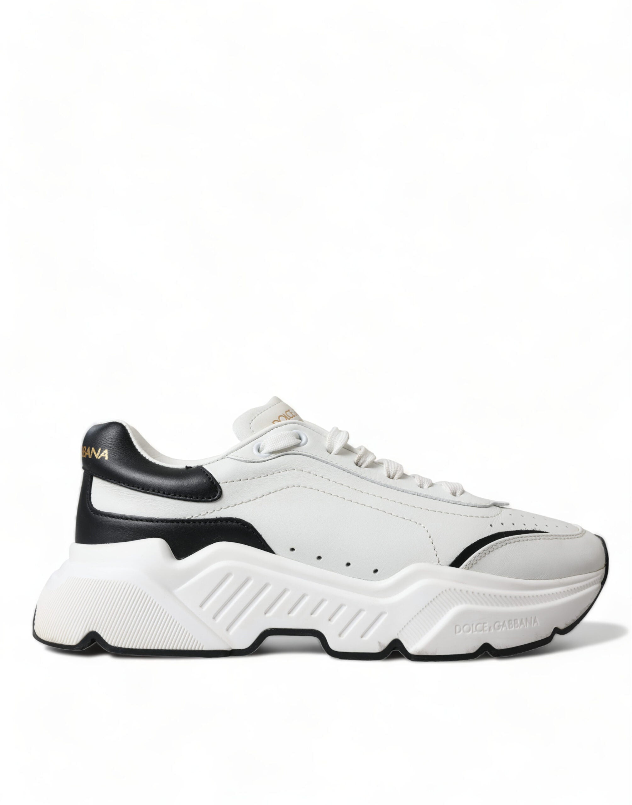 White and black low-top Daymaster sneakers by Dolce & Gabbana with sleek design and laced closure.