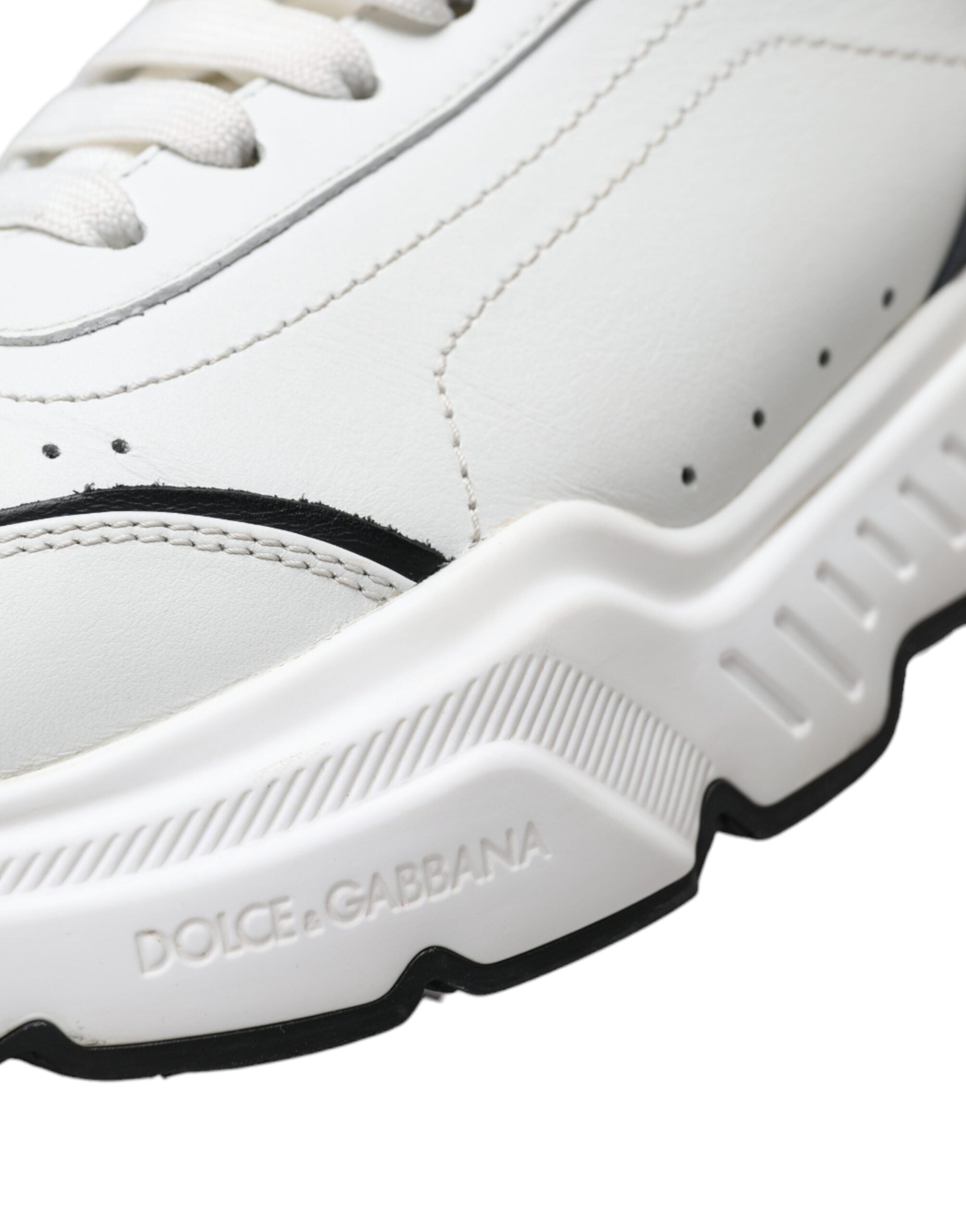 White and black Dolce & Gabbana low-top Daymaster sneakers with sleek design and branded logo on the side.