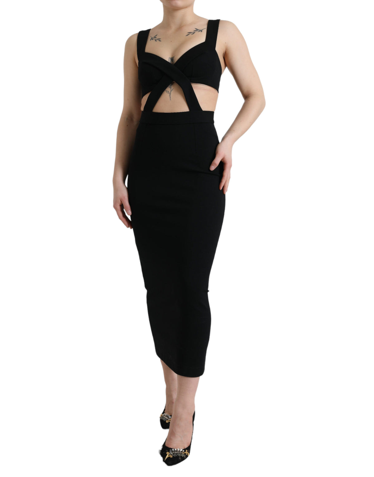 Black cut-out sleeveless bodycon midi dress by Dolce & Gabbana, shown on a model with fitted silhouette and stylish design.