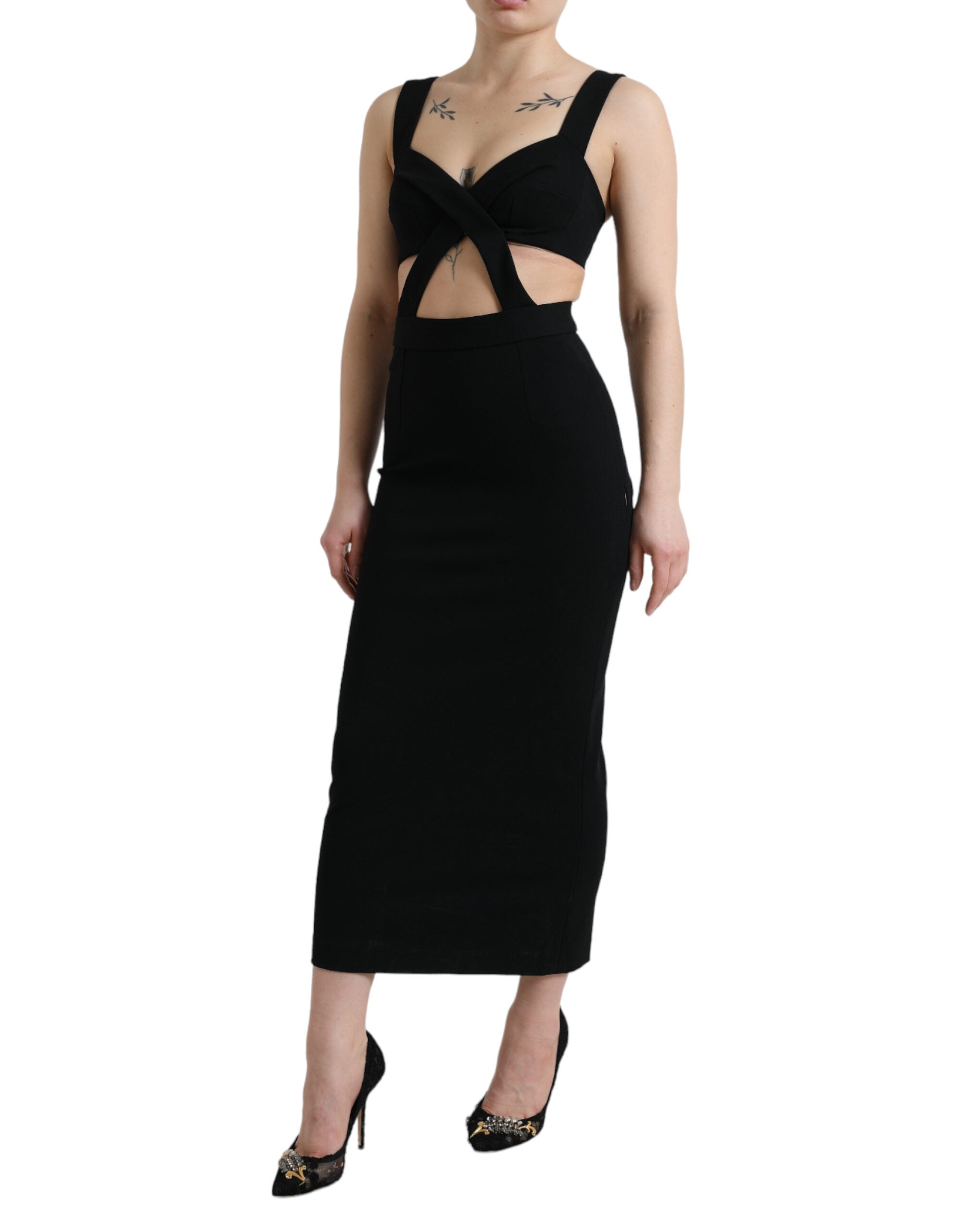 Black cut-out sleeveless bodycon midi dress by Dolce & Gabbana, showcasing a fitted design with stylish cut-outs and sleek silhouette.