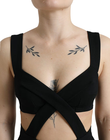 Black cut-out sleeveless bodycon midi dress by Dolce & Gabbana, showing fitted silhouette and stylish design details.