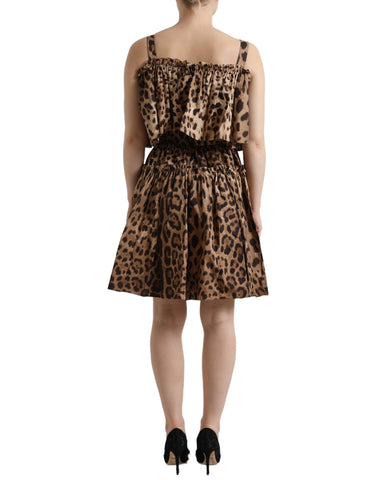 Brown leopard print sleeveless A-line dress by Dolce & Gabbana hanging on a clothing rack.
