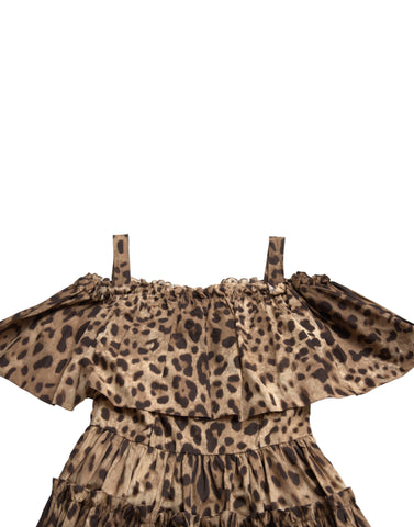 Brown leopard print sleeveless A-line dress by Dolce & Gabbana hanging on a mannequin.