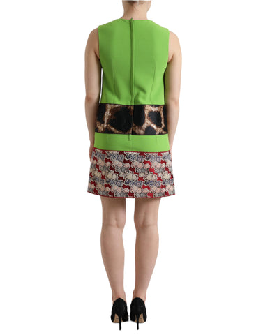 Apple green sleeveless panelled shift dress by Dolce & Gabbana, shown on a dress form with a fitted silhouette and subtle fabric texture.