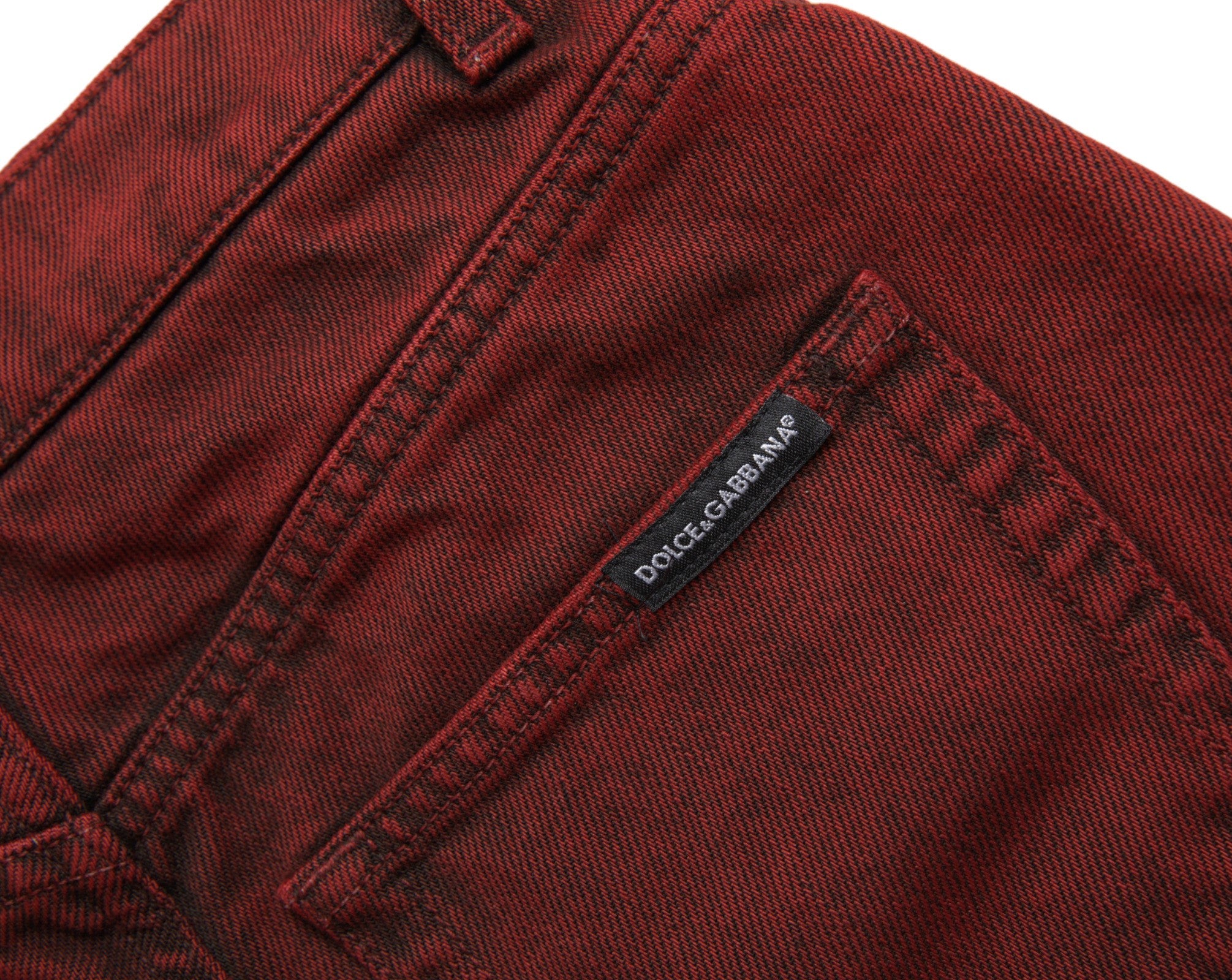 Red high waist denim hot pants shorts by Dolce & Gabbana, featuring stretch fabric and a fitted style.