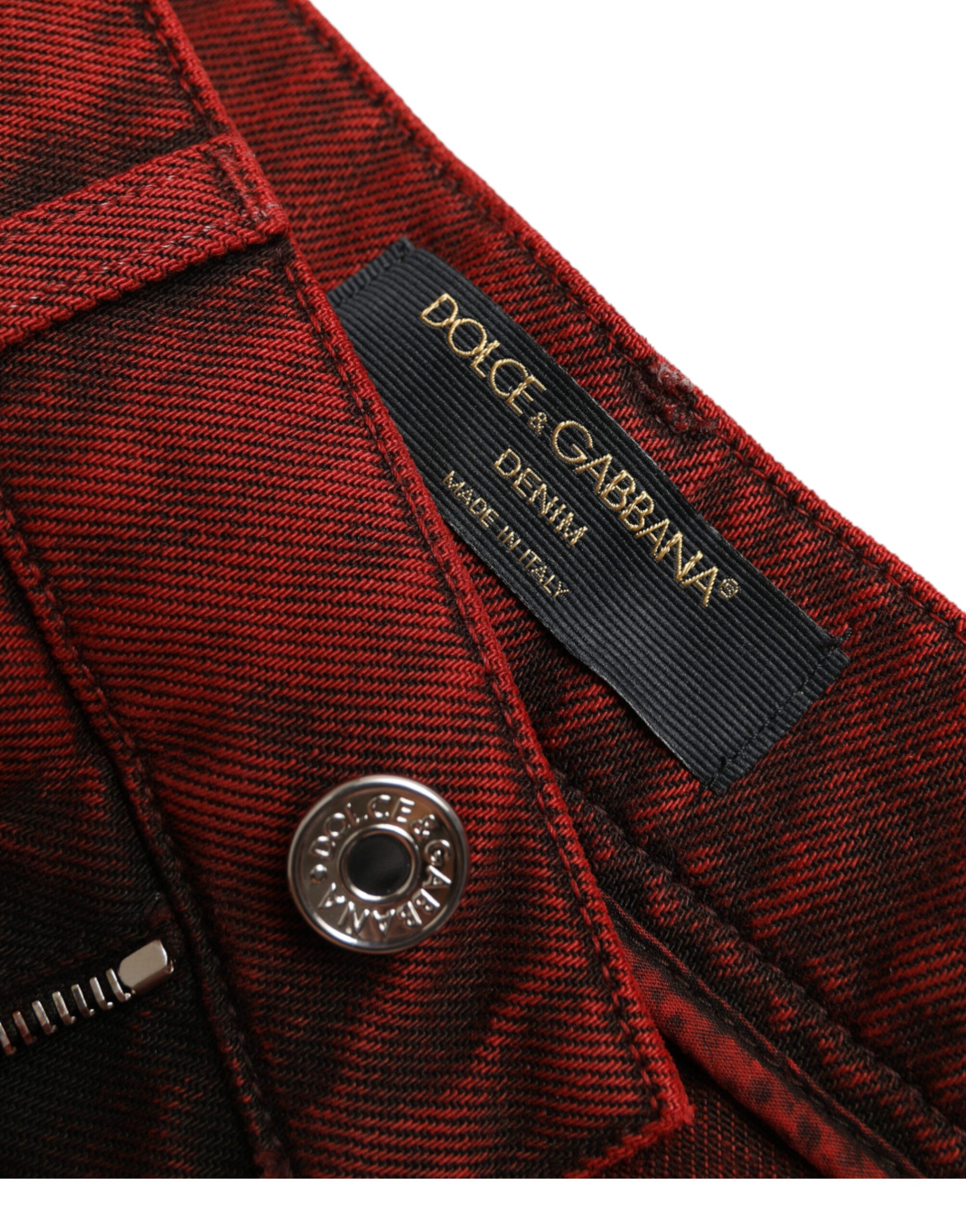 Red stretch high waist denim hot pants shorts by Dolce & Gabbana, showing close-up of fitted waistband and playful style.