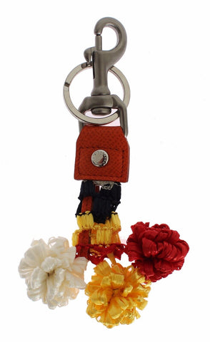 Red and white raffia leather clasp keyring with Dolce & Gabbana branding, designed as a stylish finder or keychain accessory.