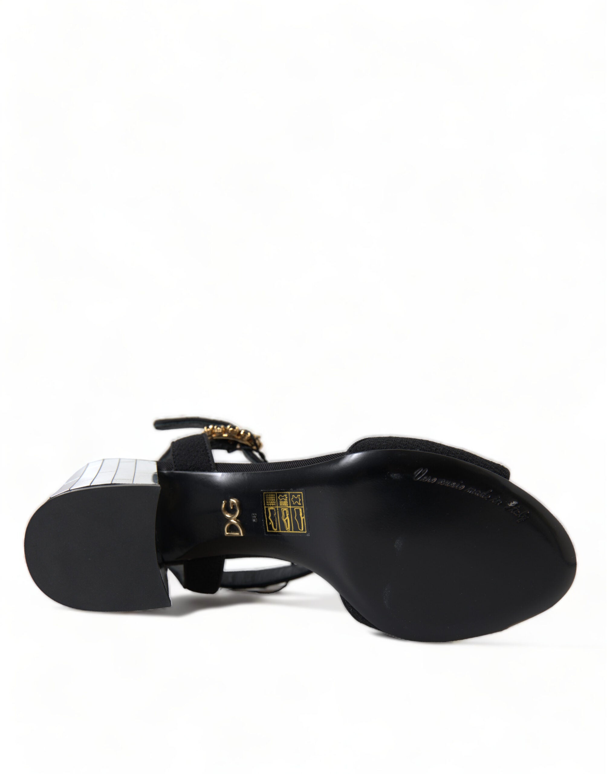 Black Crystals ankle strap sandals by Dolce & Gabbana with sparkling crystal embellishments and open toe design.