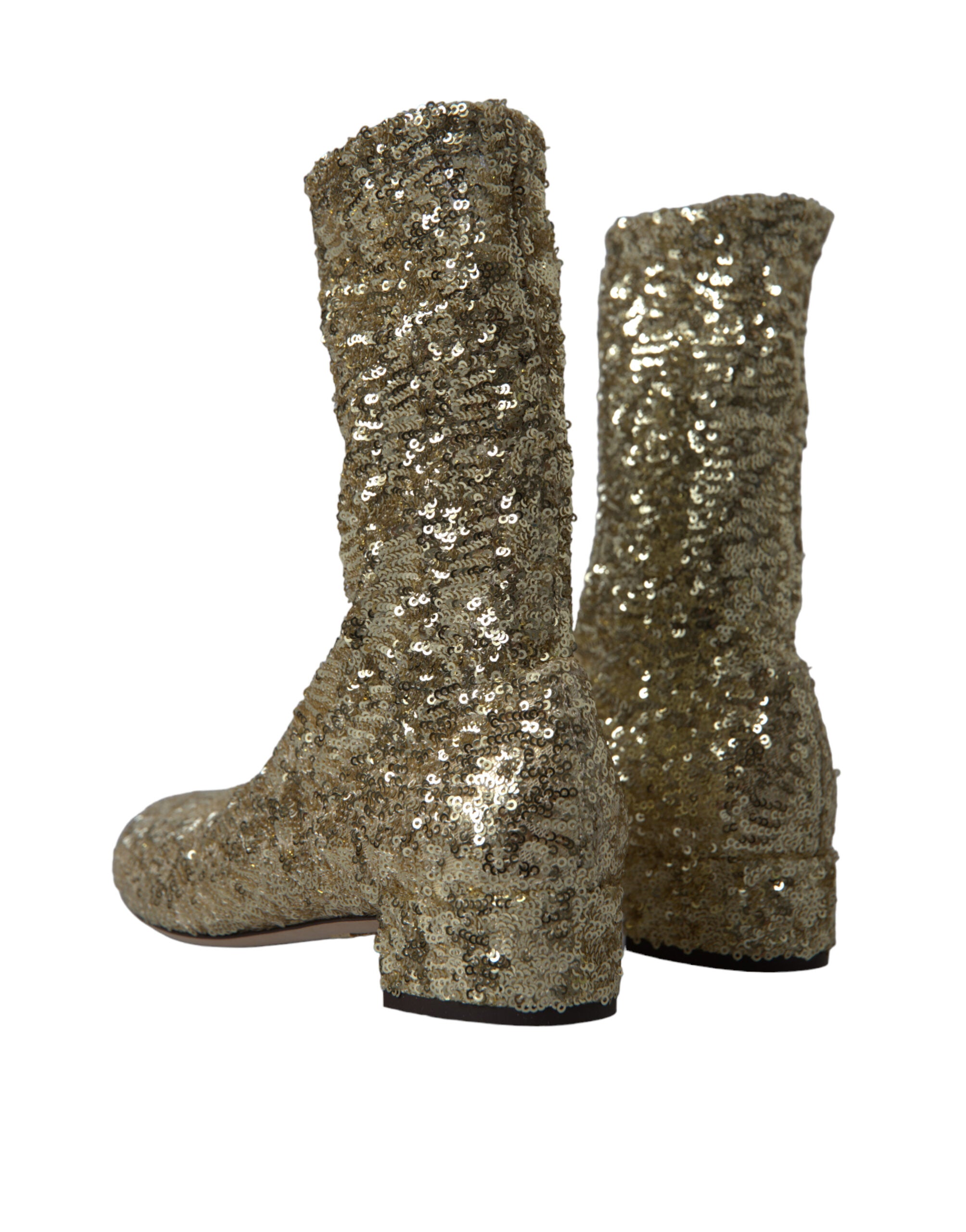 Gold sequined short stretch boots by Dolce & Gabbana, stylish footwear with shimmering sequined design and sleek silhouette.