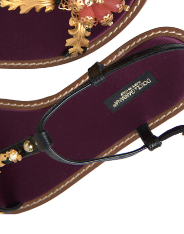 Black crystal and gold leather sandals by Dolce & Gabbana with elegant straps and stylish design.