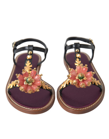 Black crystal and gold leather sandals by Dolce & Gabbana, featuring intricate crystal embellishments and elegant design.