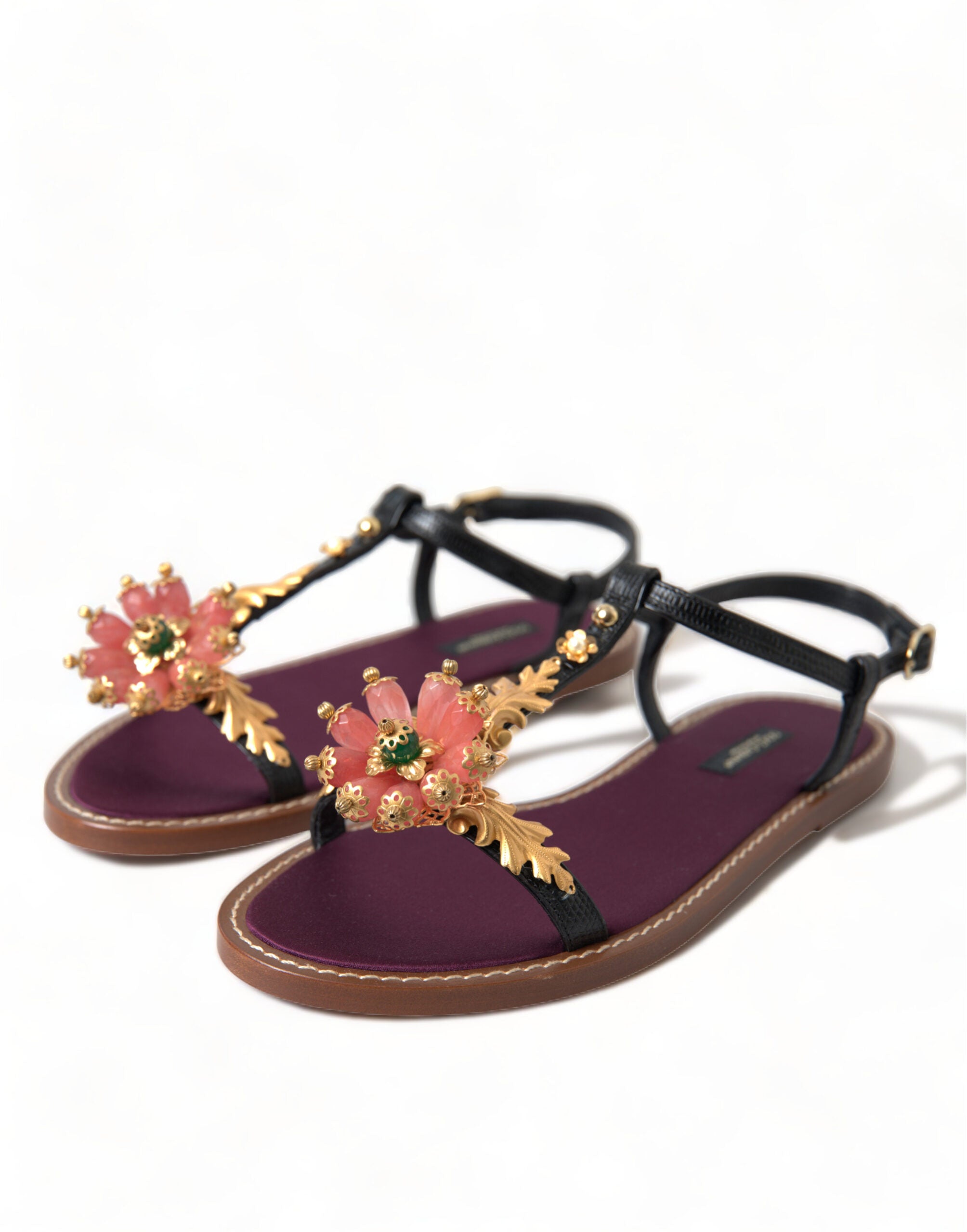 Black crystal and gold leather sandals by Dolce & Gabbana with strappy design and elegant detailing.