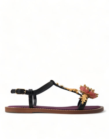 Black crystal and gold leather sandals by Dolce & Gabbana, featuring elegant straps and a stylish design.