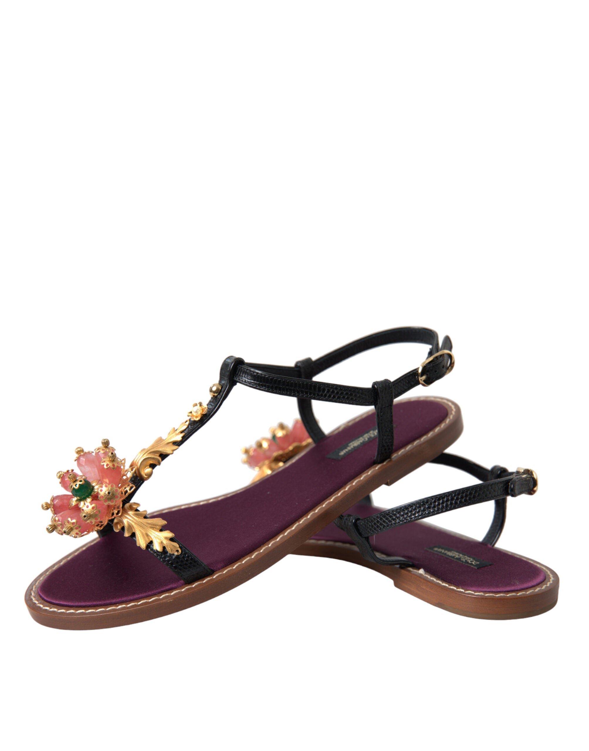 Black crystal and gold leather sandals by Dolce & Gabbana featuring elegant straps and a stylish design.