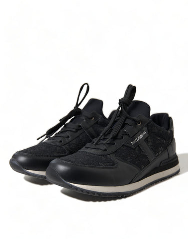 Black floral lace leather sneakers from Dolce & Gabbana with intricate lace details and sleek sneaker design.