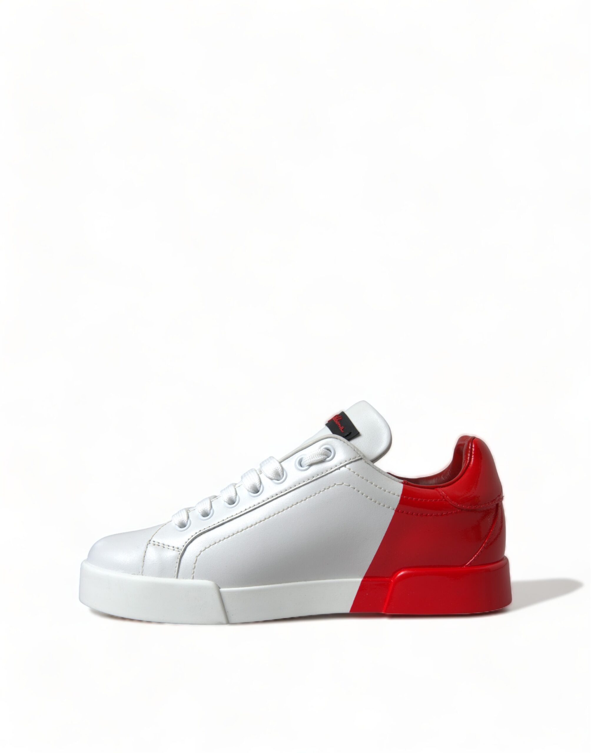 White and red lace-up low top women's sneakers by Dolce & Gabbana, featuring stylish design and comfortable fit.