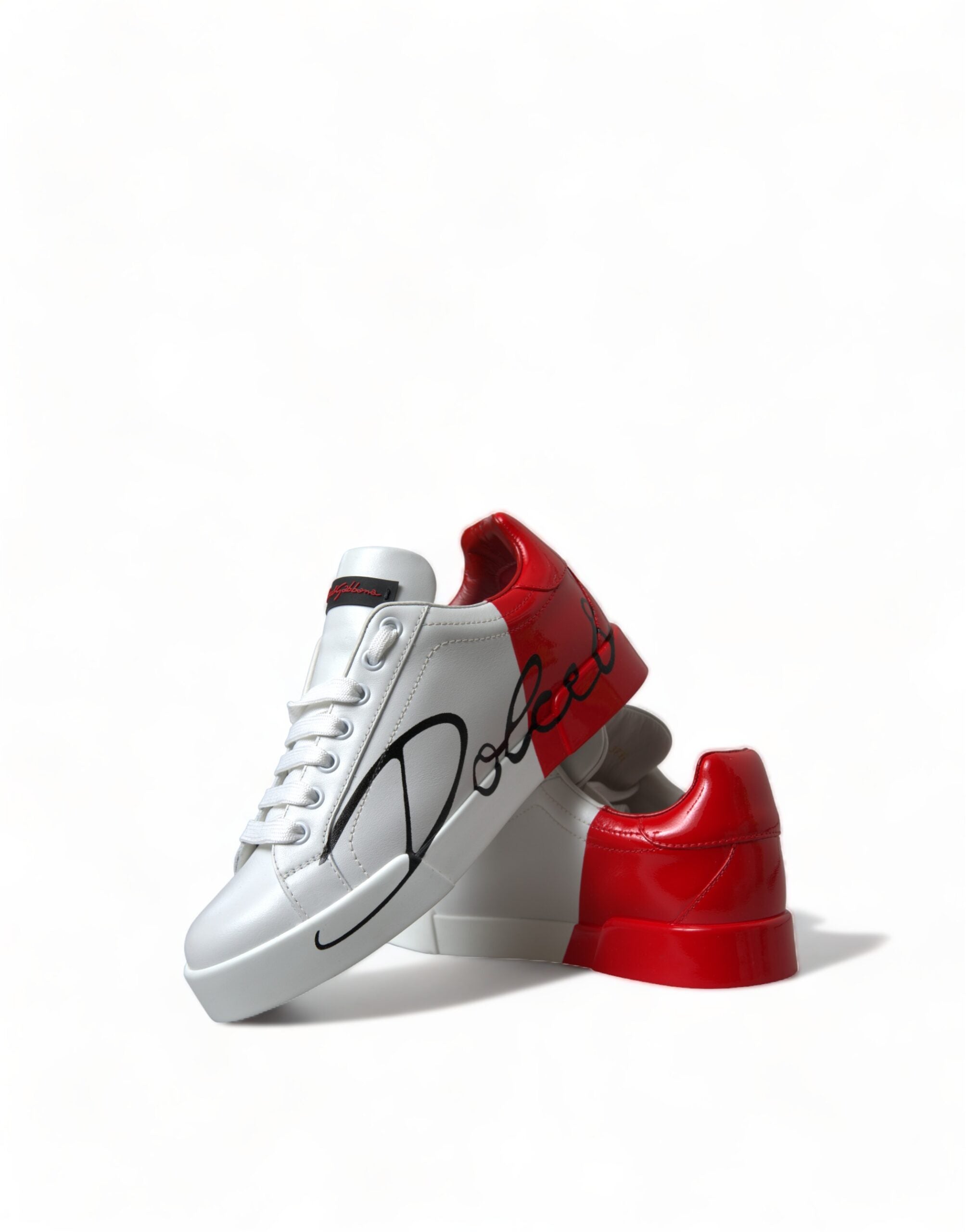 White and red lace-up women's low top sneakers by Dolce & Gabbana, featuring stylish design and comfortable fit.