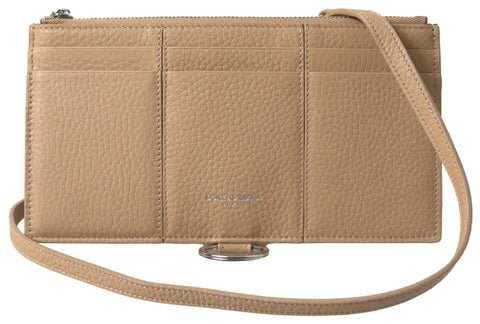 Beige leather shoulder cardholder with strap from Dolce & Gabbana, featuring multiple card slots and a sleek design.