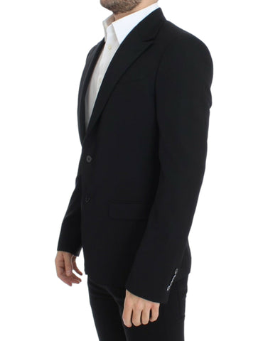 Black wool slim fit blazer by Dolce & Gabbana, tailored with a sleek design and classic lapel, ideal for formal or stylish occasions.
