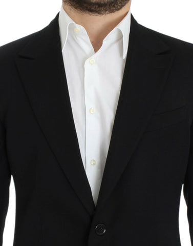 Black wool slim fit blazer by Dolce & Gabbana, tailored fit with notch lapel and button closure, styled on a hanger.