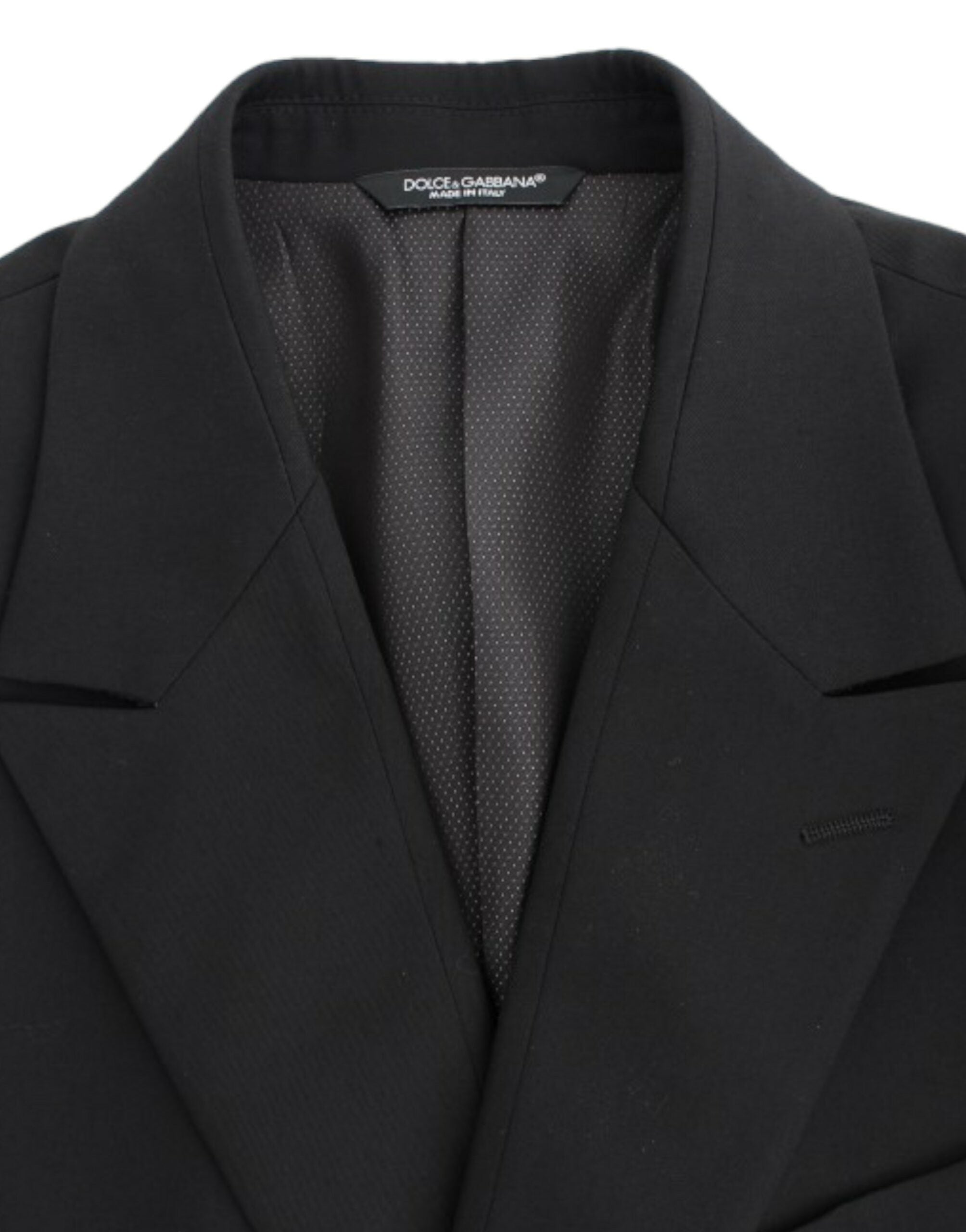 Black wool slim fit blazer by Dolce & Gabbana, tailored with a sleek design and classic lapel collar, displayed on a mannequin.
