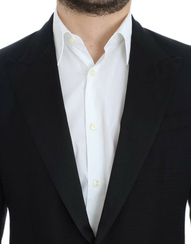 Black wool silk Sicilia blazer by Dolce & Gabbana, featuring tailored fit and elegant lapel details, displayed on a mannequin.