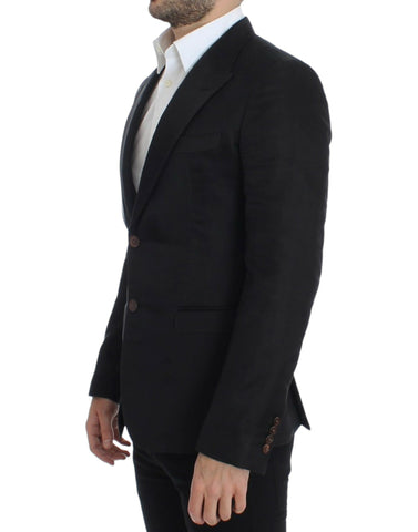 Black silk slim fit blazer by Dolce & Gabbana, tailored with a sleek, fitted design and classic lapel details.