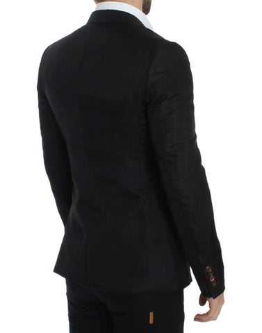 Black silk slim fit blazer by Dolce & Gabbana, tailored with a sleek lapel and fitted style, displayed on a hanger.