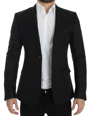 Black silk slim fit blazer by Dolce & Gabbana, tailored with a sleek design and classic lapel, displayed on a hanger.