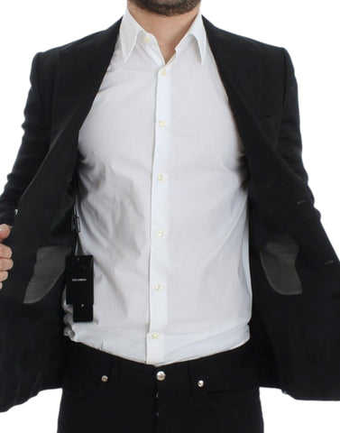 Black silk slim fit blazer by Dolce & Gabbana, tailored with a sleek design and classic lapel, shown on a model.