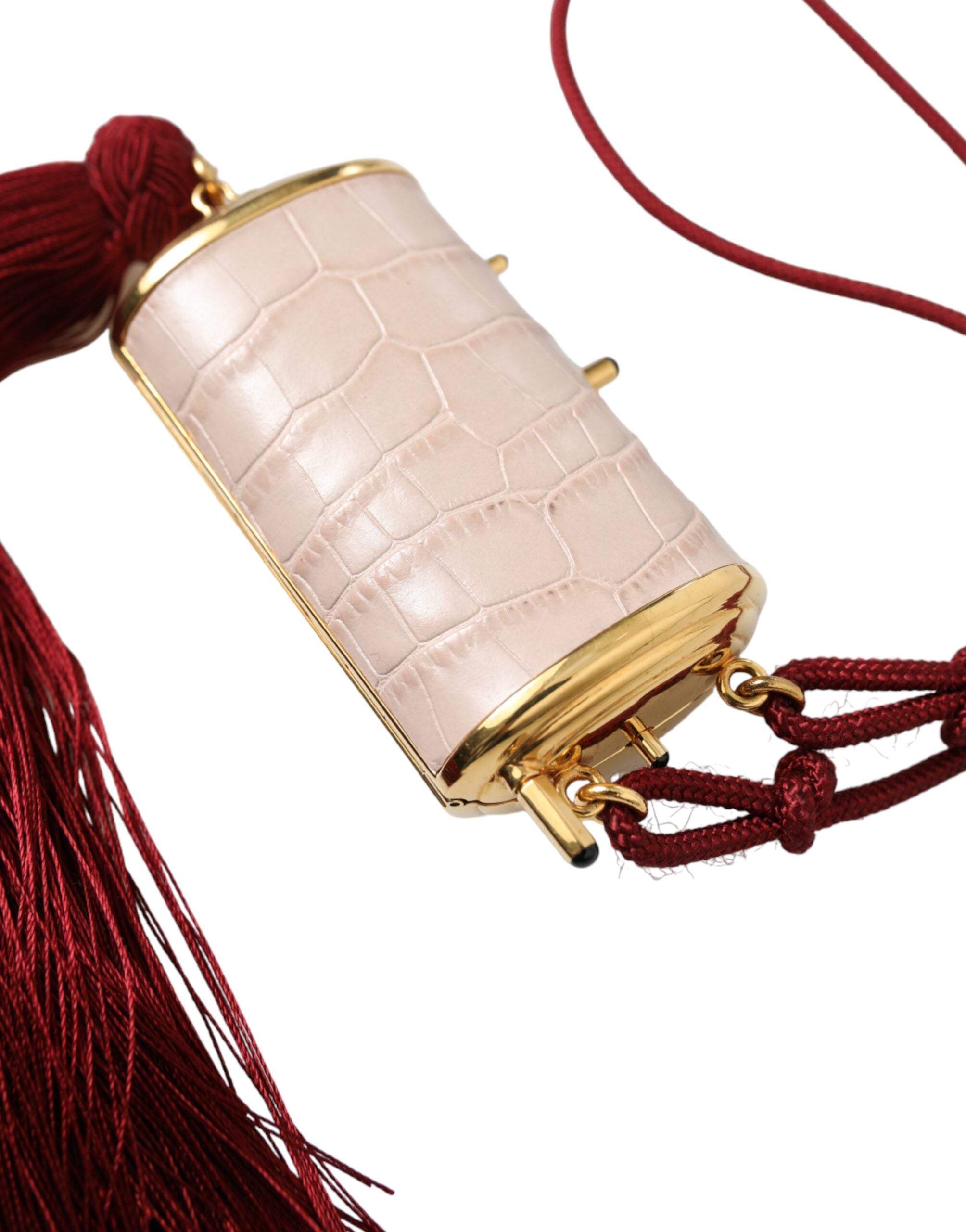 Pink exotic leather mini makeup bag with tassel and mirror by Dolce & Gabbana, featuring a compact and stylish design.